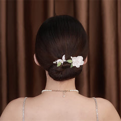 Takeberny finished French twist displaying smooth, professional-looking updo