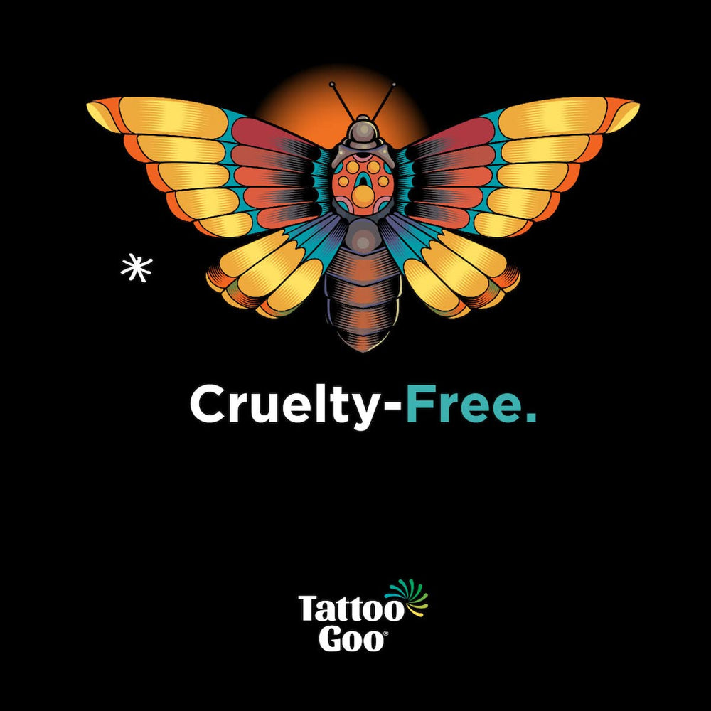 Tattoo Goo bottle held in hand showing small travel-friendly 2 oz benefit