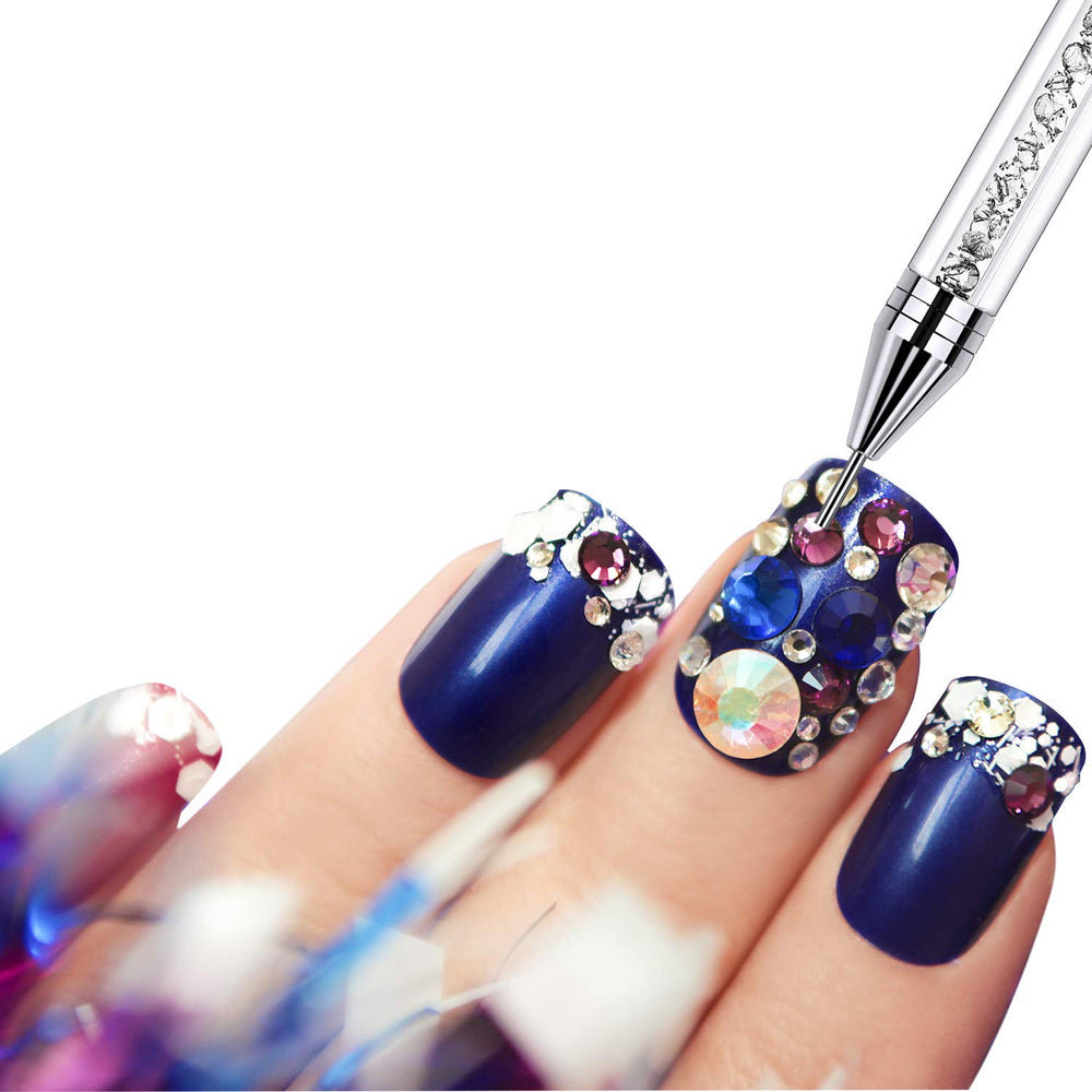 Tatuo flatlay with pens, rhinestones and tools showing organized manicure setup