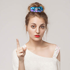 Tatuo scrunchies on a dresser as party-ready, decorative hair accessories
