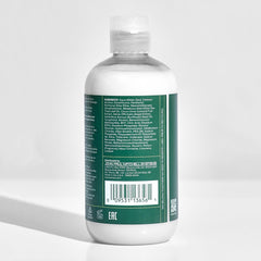 Bathroom shelf with Tea Tree bottle staged for an inviting daily routine