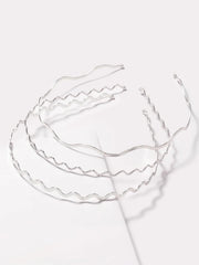 TEBIEKOY front view of three silver wavy headbands showing polished finish and versatility