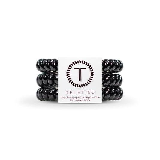 Teleties jet black three‑pack front view showing compact packaging and convenience