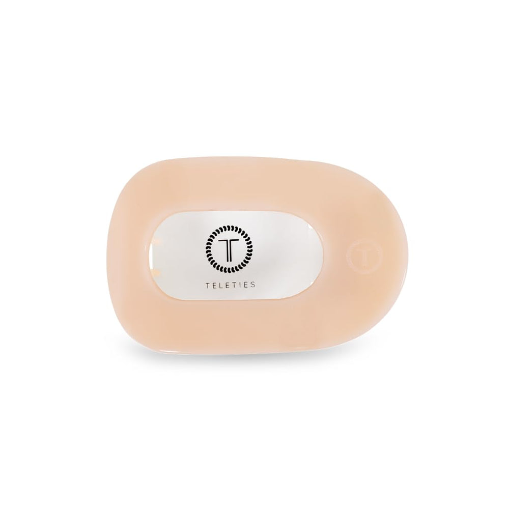 TELETIES medium flat round clip front view showing almond beige and secure hold