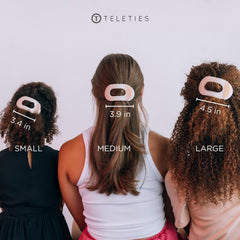 TELETIES medium clip in hand for size comparison showing capacity for medium-thick hair