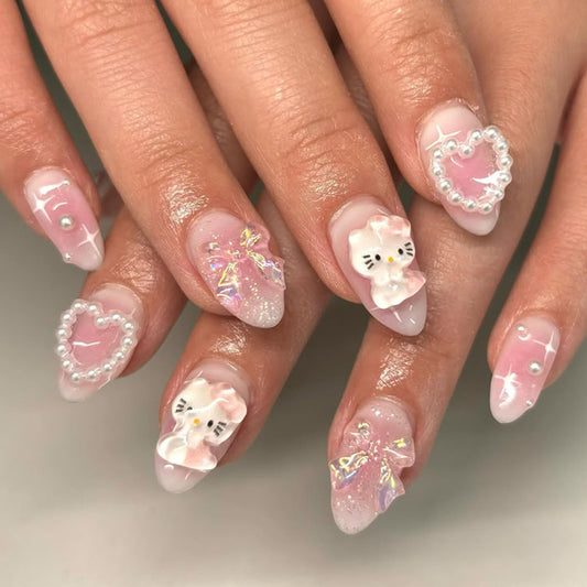 Temote front display of 24 pink almond press-on nails showing full set and decorations