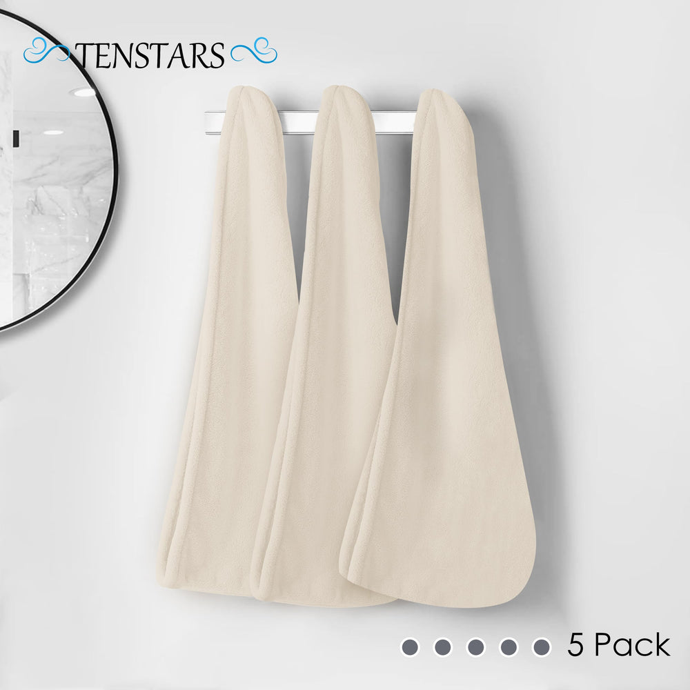 TENSTARS towel in hand for size comparison and travel-friendly benefit