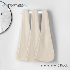 TENSTARS towel in hand for size comparison and travel-friendly benefit