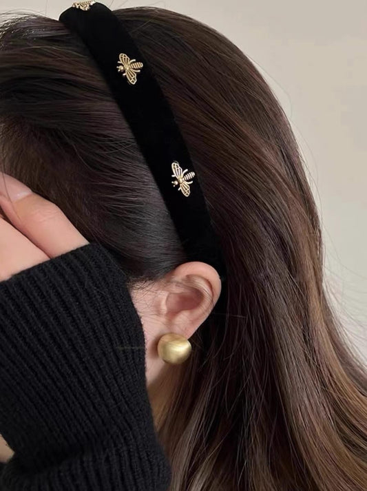 TERSE black velvet headband front view showing elegant look and comfortable fit