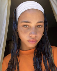 TERSE model wearing headband during yoga for sweat control and hair management