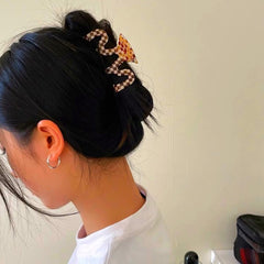 Textention clip in hair updo demonstrating reliable hold for medium-thick hair