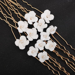 Teyglen hair pin beside hand showing 8.5cm scale for styling reference