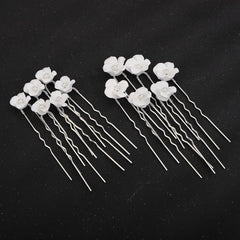 Teyglen pins placed in bridal updo giving secure hold and elegant sparkle