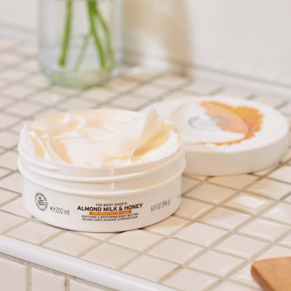 The Body Shop almond milk body butter with almonds and shea to highlight ingredients
