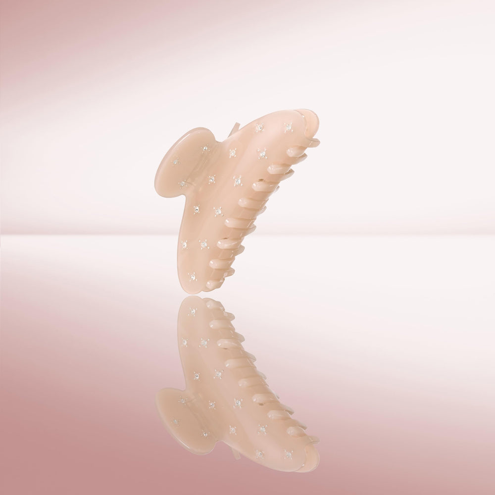 The Hair Edit clip placed with outfit accessories shows neutral versatility and polished finish
