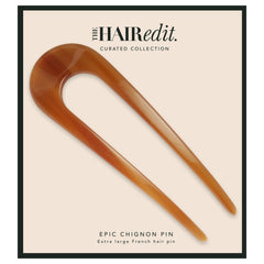 The Hair Edit front view of extra large chignon pin showing warm caramel finish and sleek look