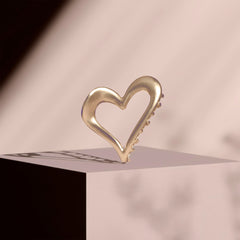 The Hair Edit heart clip in hair half-up demonstrating secure styling and flattering lift benefit: tidy finish