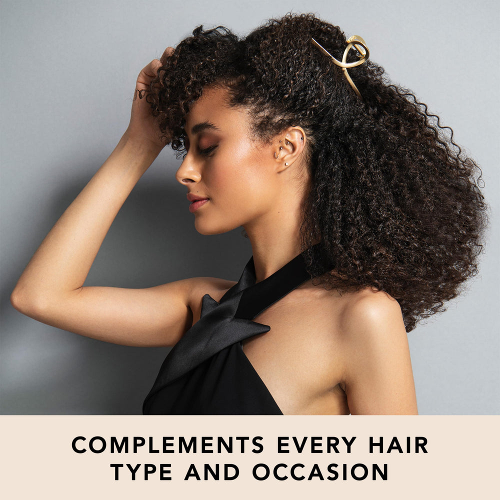 The Hair Edit clip in hair securing a French twist, providing polished long-lasting style
