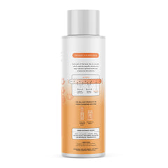 The Honey Pot Company bottle photographed with grapefruit and ylang ylang flower