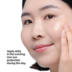 The Ordinary bottle held in hand to show true 1 fl oz size and travel convenience