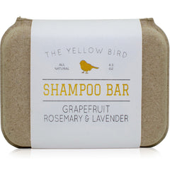 The Yellow Bird front packaging showing shampoo bar and scent label, clear product identity