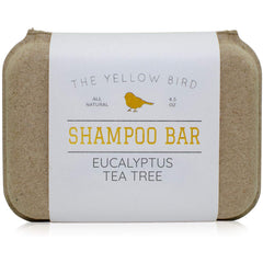 The Yellow Bird front-facing shampoo bar showing label and shape with clear eco benefit