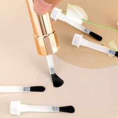 Thinp brush in use applying polish to nail for faster, cleaner manicures
