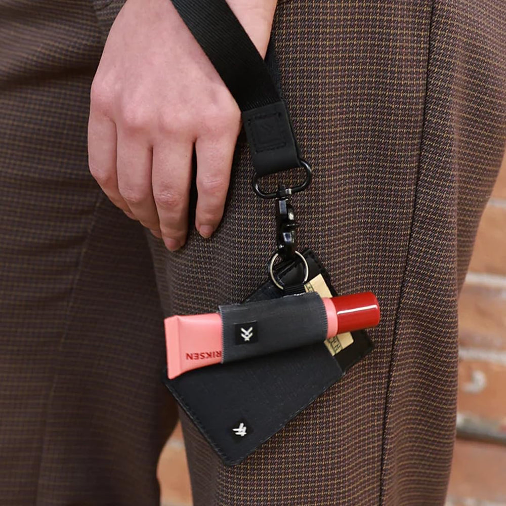 Thread Wallets holder clipped to outdoor bag showing secure carry for travel and hiking