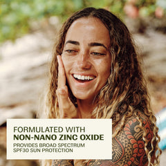 Thrive Natural Care sunscreen being applied from tube, easy layering benefit