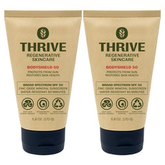 Thrive Natural Care front tube showing product and SPF50 benefit