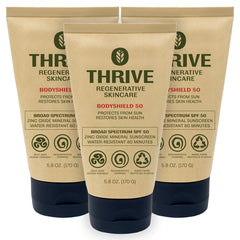 Thrive Natural Care front tube showing label and SPF50 protection benefits