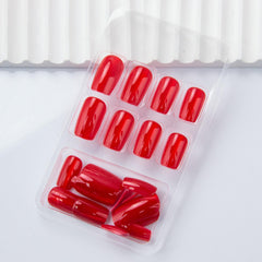 Thuoxde hands applying a press-on nail with jelly adhesive for quick at-home salon results