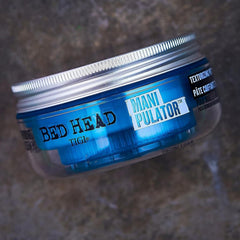 TIGI Bed Head 2 oz next to ruler demonstrating travel size
