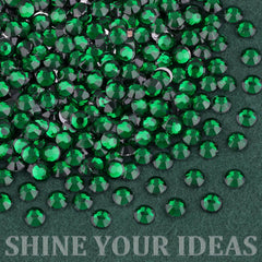 TINKRSTUFF gems next to a coin for scale showing size variety and selection
