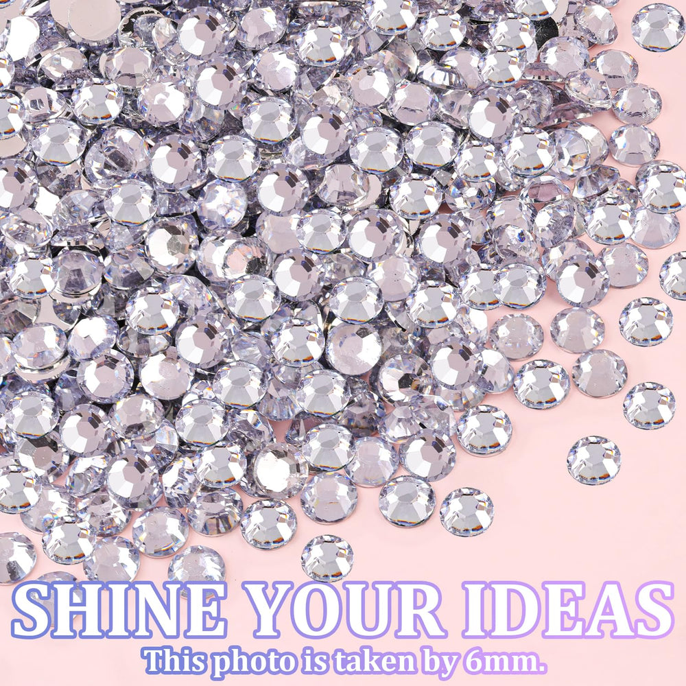 TINKRSTUFF hand holding gems for scale to show size variety and quantity
