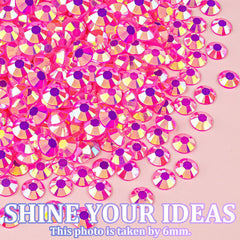 TINKRSTUFF rhinestones held next to a fingertip to show size range and practical scale