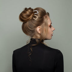 TIOSRU metal U-shaped hair pin close-up highlighting secure grip and durable finish