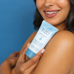 TIZO sunscreen drops on skin illustrating moisturizing, non-greasy feel