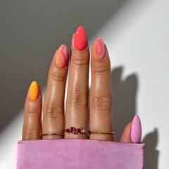 Tnbuokas front packaging showing colorful press on nails and included glue benefit convenience
