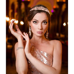 TOBATOBA tiara held in hand showing lightweight, wearable scale