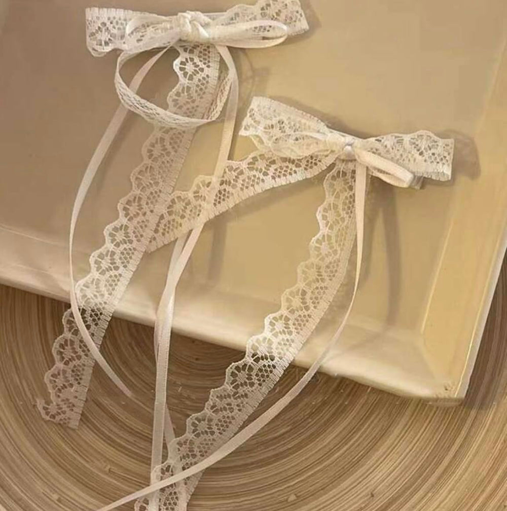 Tobeffect white lace bow front view showcasing delicate shape and feminine finish
