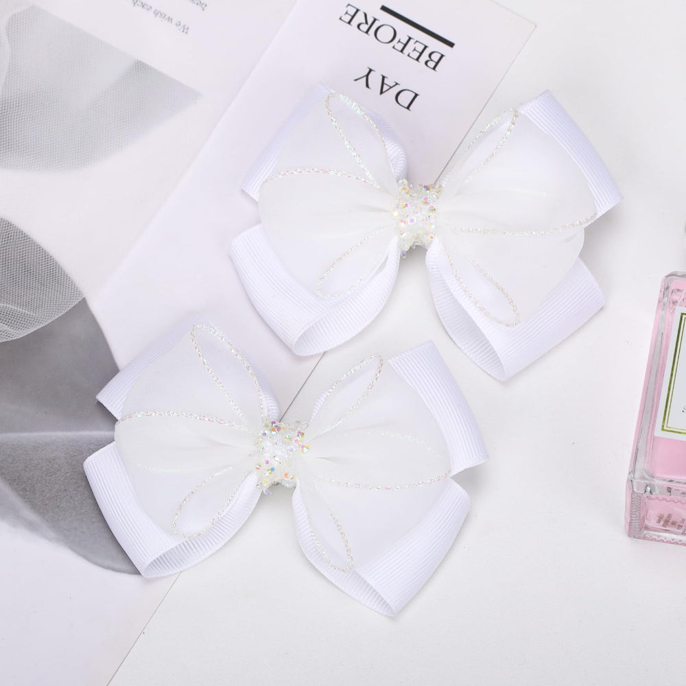 TOFAEVN bows styled in pigtails illustrating symmetrical look and easy use