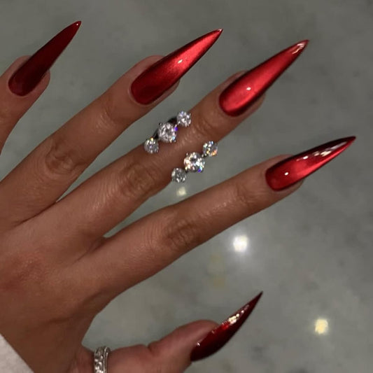TOGZOM front packaging showing 24 red cat eye nails and accessories for instant glam