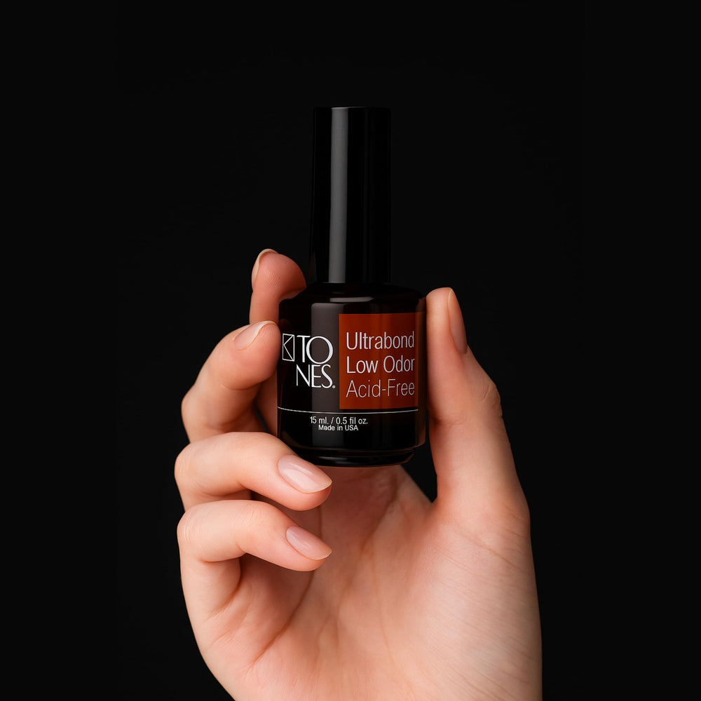 TONES Ultrabond next to ruler showing 15ml bottle scale for salon and travel