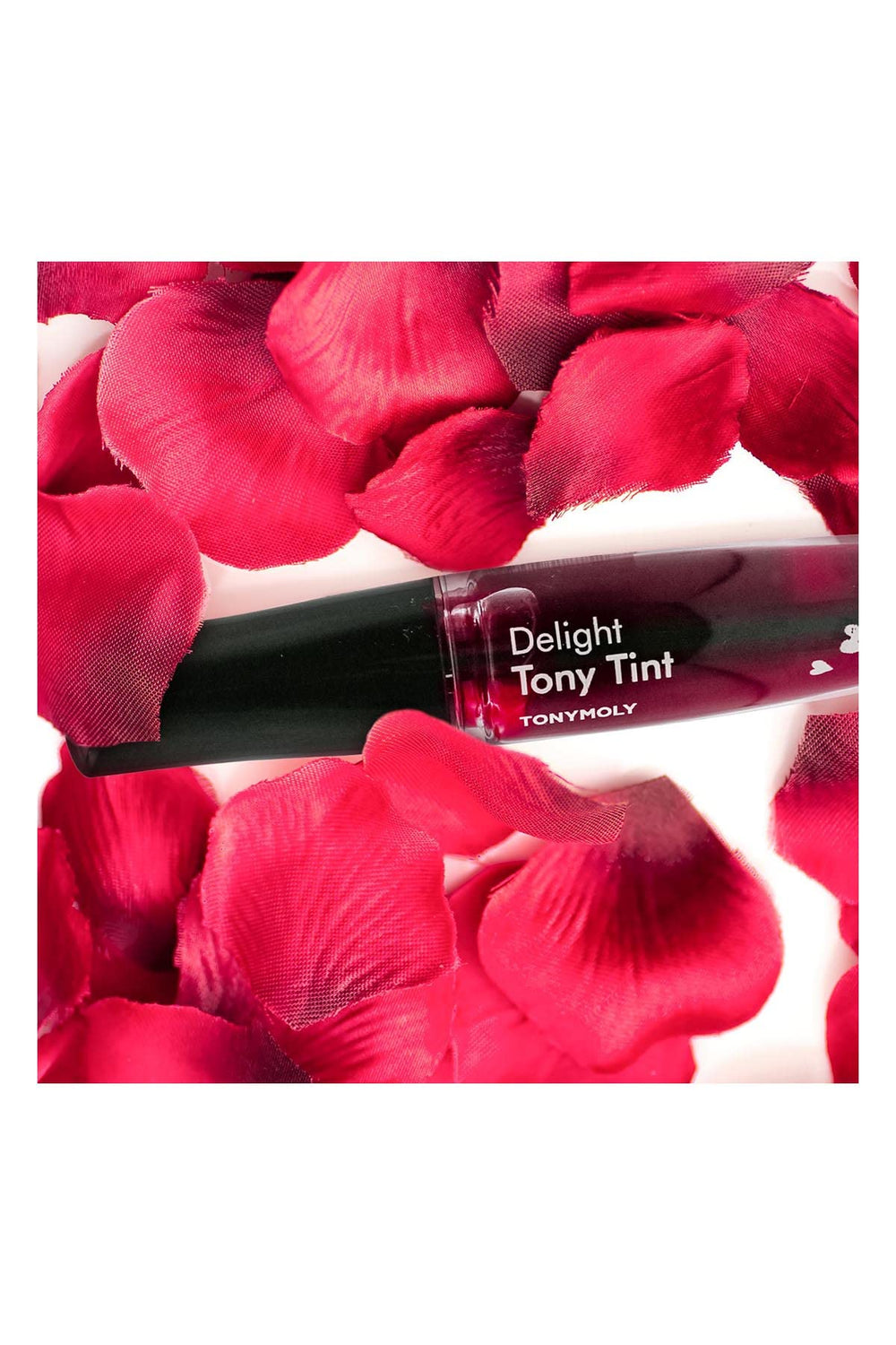 TONYMOLY tube next to a coin for scale, compact travel-friendly size visible