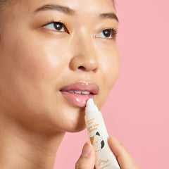 TONYMOLY hand and lip set held in hands for scale and travel-friendly convenience