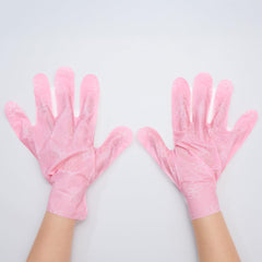 TONYMOLY vanilla sugar hand mask worn on hands demonstrating softening results