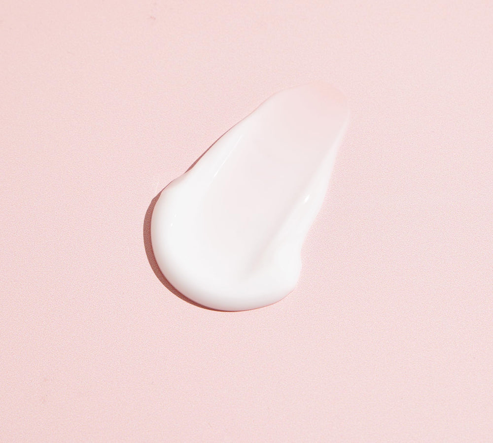 TONYMOLY cream in bathroom setting applied on hand, demonstrates soft plump skin