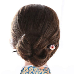 TOP SEWING hairpin on neutral background displays dark ebony tone and simplicity