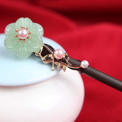 TOP SEWING in use securing a classic bun for polished everyday style